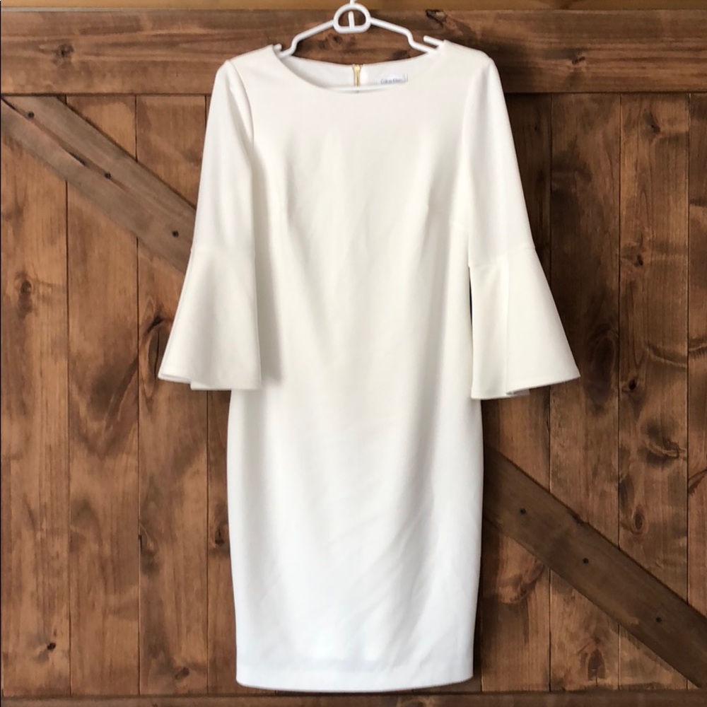 White Calvin Klein bell sleeve dress